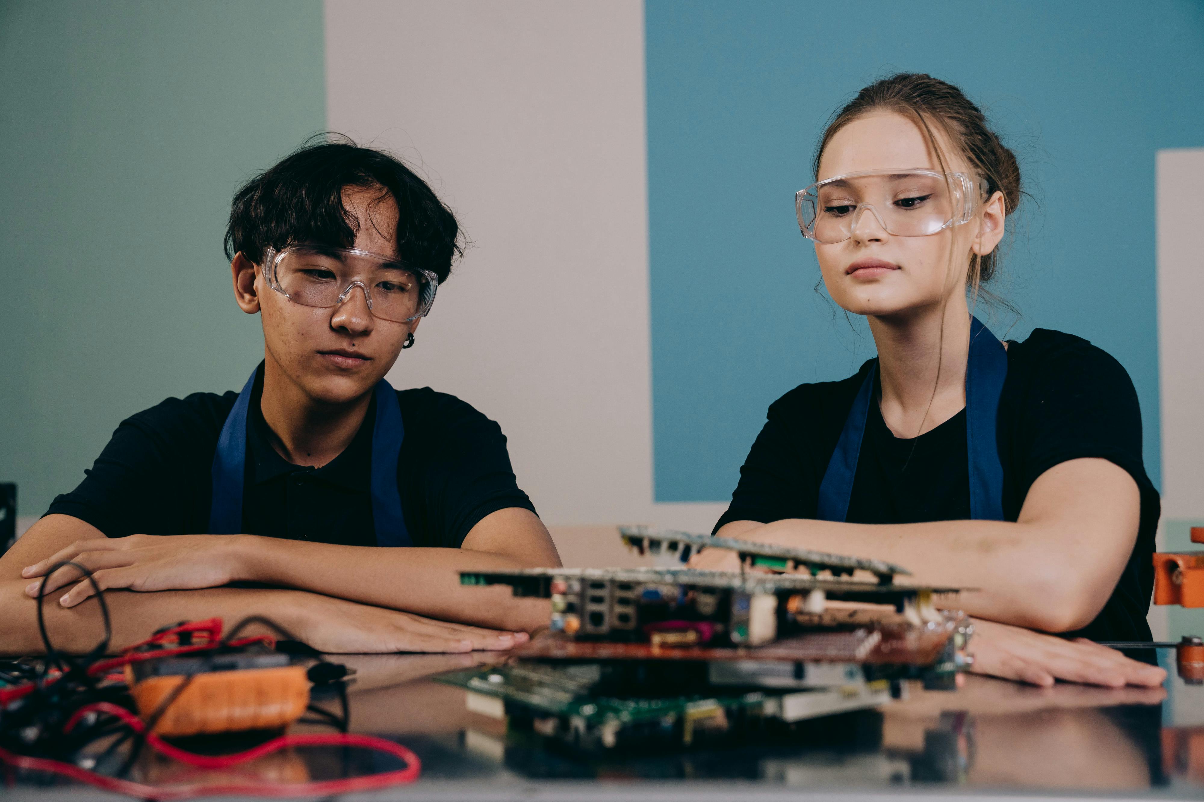 A group of students working together on a project at a table.
